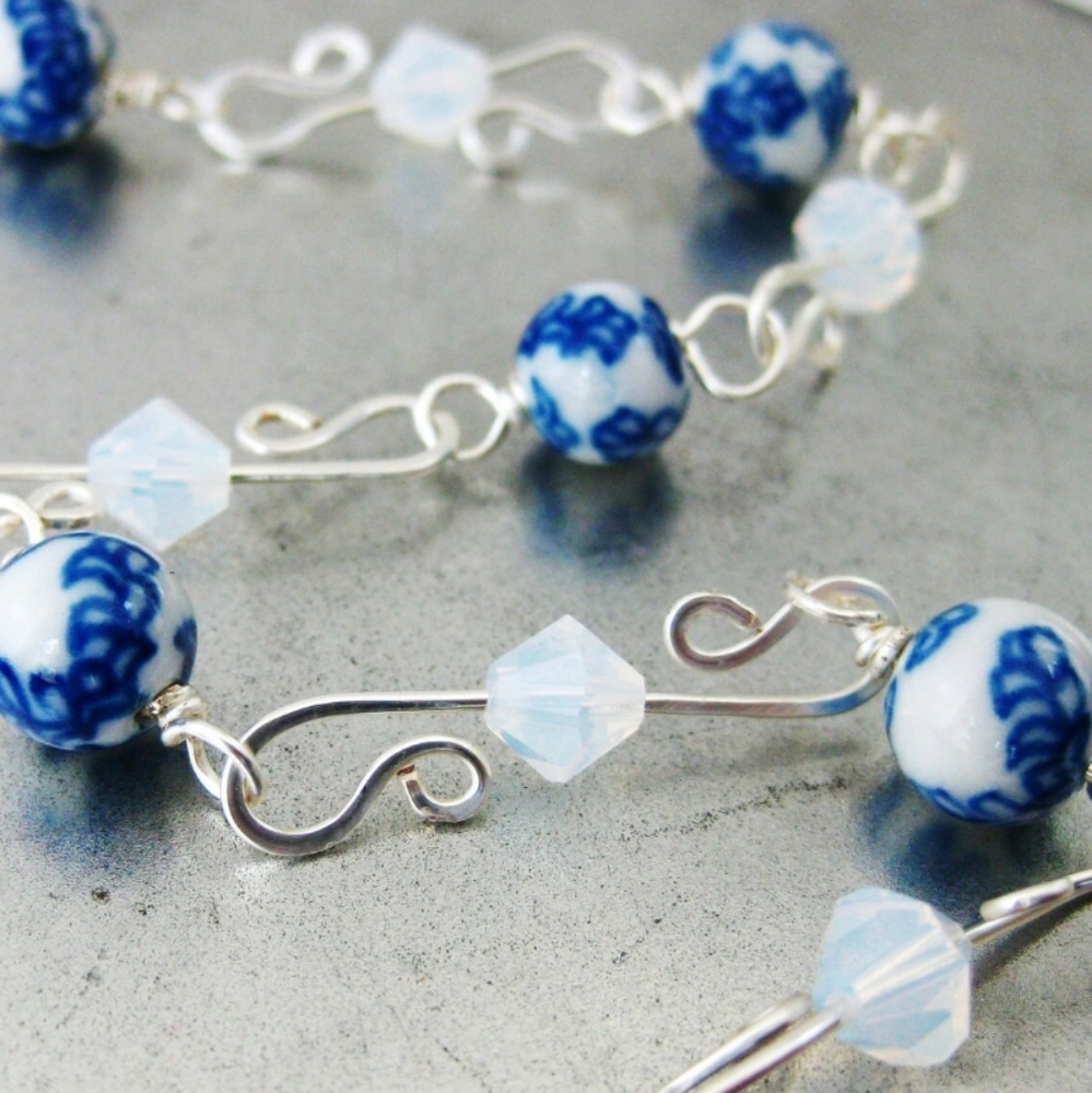 Handcrafted wire worked S hook chain bracelet. This bracelet consists white and